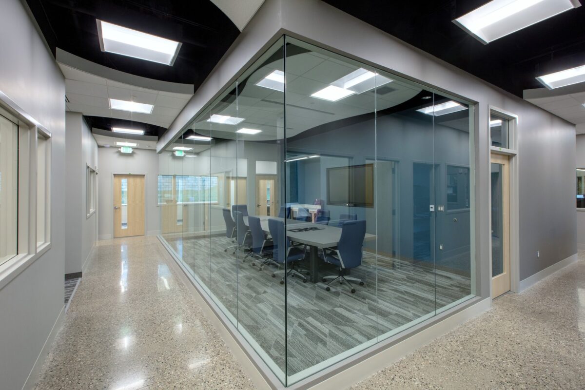 indoor glass meeting space in DHE Plumbing & Mechanical