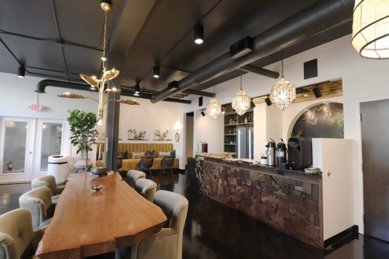 Interior view of large table seating Treetops Collective — Phase II